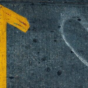 a yellow triangle on a road